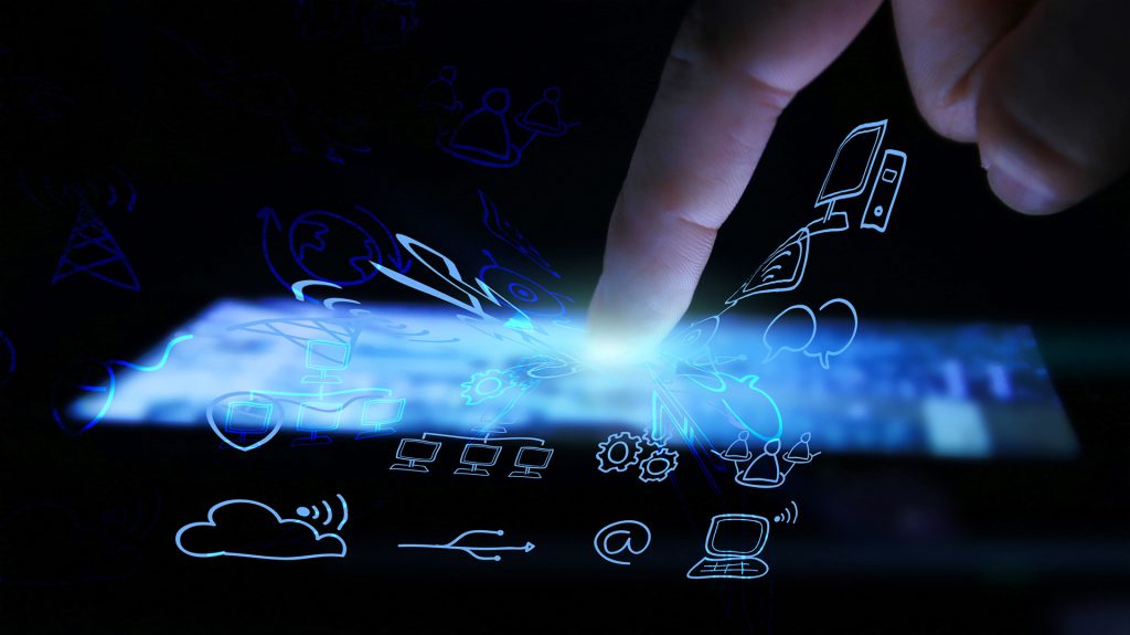 A finger touches a glowing tablet screen surrounded by blue digital icons for email, cloud, and networking.